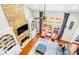 Open living space featuring stone fireplace, cathedral ceilings, and a large bay window at 380 Victorian Ln, Duluth, GA 30097