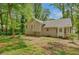 Exterior view of the backyard showcasing the home's architecture and outdoor space at 425 Shelby Ln, Hiram, GA 30141