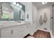 Bathroom showcasing double vanity, sleek white cabinetry, and modern fixtures at 425 Shelby Ln, Hiram, GA 30141