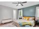 Bright bedroom featuring stylish decor, a ceiling fan, and ample natural light at 425 Shelby Ln, Hiram, GA 30141