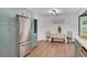 Kitchen featuring green cabinets, stainless steel refrigerator, and breakfast nook at 425 Shelby Ln, Hiram, GA 30141