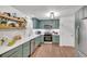 Modern kitchen with shaker cabinets, stainless steel appliances, and white subway tile backsplash at 425 Shelby Ln, Hiram, GA 30141