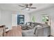 Relaxing living room featuring a gray sectional sofa, a view into the entryway, and ample natural light at 425 Shelby Ln, Hiram, GA 30141
