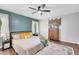 Bedroom featuring a ceiling fan, hardwood floors, and natural light at 425 Shelby Ln, Hiram, GA 30141