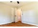 A bedroom featuring sleek hardwood floors and closet doors that match the walls at 45 Driskell Ave, Mableton, GA 30126