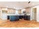 A modern kitchen that shows the island, stainless steel appliances, and sleek hardwood floors at 45 Driskell Ave, Mableton, GA 30126