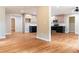 Open-concept living room with hardwood floors connecting to the kitchen at 45 Driskell Ave, Mableton, GA 30126