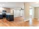Open-concept living room with hardwood floors, kitchen island, and neutral paint at 45 Driskell Ave, Mableton, GA 30126