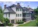 Rear exterior view highlighting the multi-level deck, screened porch, lush yard, and garage at 4559 Paradise Shoals Se Rd, Atlanta, GA 30339