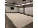 Finished basement with a large open area, recessed lighting, ceiling fans, and neutral carpeting at 4559 Paradise Shoals Se Rd, Atlanta, GA 30339