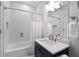 A clean bathroom featuring subway tile, classic fixtures, and a shower-tub combo at 4559 Paradise Shoals Se Rd, Atlanta, GA 30339