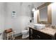 Powder room boasts a vessel sink, granite countertop, and stylish decor at 4559 Paradise Shoals Se Rd, Atlanta, GA 30339