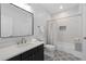 Modern bathroom featuring a sleek vanity, tiled shower, and patterned floor at 4559 Paradise Shoals Se Rd, Atlanta, GA 30339