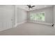 Bright, neutral bedroom with plantation shutters and carpet at 4559 Paradise Shoals Se Rd, Atlanta, GA 30339