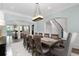 Open dining room with seating for eight, connecting to the living room and stairway for easy access at 4559 Paradise Shoals Se Rd, Atlanta, GA 30339