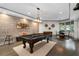Game room with a pool table, unique lighting, hardwood floors, and decorative accents at 4559 Paradise Shoals Se Rd, Atlanta, GA 30339