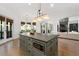 Eat-in kitchen featuring an oversized island with breakfast bar, stainless appliances and ample counter space at 4559 Paradise Shoals Se Rd, Atlanta, GA 30339