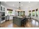 Bright kitchen with large center island, stainless steel appliances, ample counter space, and breakfast nook at 4559 Paradise Shoals Se Rd, Atlanta, GA 30339