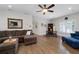 An open living room with hardwood floors, ample seating, and a view of the backyard at 4559 Paradise Shoals Se Rd, Atlanta, GA 30339