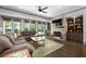 Inviting living room with a fireplace, built-in shelving, and hardwood floors at 4559 Paradise Shoals Se Rd, Atlanta, GA 30339