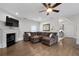 A cozy living room with a fireplace, hardwood floors, and a comfortable sectional sofa at 4559 Paradise Shoals Se Rd, Atlanta, GA 30339