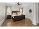 Spacious main bedroom boasts hardwood floors, neutral colors and plenty of natural light at 4559 Paradise Shoals Se Rd, Atlanta, GA 30339