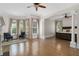 Open-concept primary bedroom featuring hardwood floors, bay windows, and a seating area at 4559 Paradise Shoals Se Rd, Atlanta, GA 30339