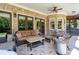 Back patio featuring comfortable seating, an outdoor kitchen area, and a decorative rug at 4559 Paradise Shoals Se Rd, Atlanta, GA 30339