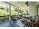 Inviting porch with ample seating, a swing, and views of lush greenery at 4559 Paradise Shoals Se Rd, Atlanta, GA 30339