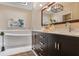 Bright bathroom featuring a soaking tub, double sink vanity, skylight, and modern light fixture at 4810 Lismoor Trce, Mableton, GA 30126