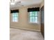 Bedroom has two windows and includes a closet with wooden doors and black valances at 4810 Lismoor Trce, Mableton, GA 30126