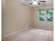 Bedroom with carpet, neutral walls, white trim, and a window view of the outdoor greenery at 4810 Lismoor Trce, Mableton, GA 30126