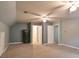 Huge bonus room features grey walls, carpet floors, three ceiling fans, and multiple closets at 4810 Lismoor Trce, Mableton, GA 30126