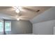 Large bonus room featuring multiple ceiling fans, grey walls, carpet floors, and two windows at 4810 Lismoor Trce, Mableton, GA 30126