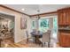 Cozy dining area features hardwood floors, elegant lighting, and a bright view of the outdoor deck at 4810 Lismoor Trce, Mableton, GA 30126