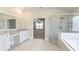 Bright bathroom featuring granite countertops, and a framed glass shower at 5381 Front Runner Ct, Sugar Hill, GA 30518