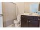 Bathroom featuring a shower with a striped curtain, a toilet, and a vanity sink at 5381 Front Runner Ct, Sugar Hill, GA 30518