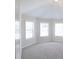 Bedroom featuring neutral carpeting and bright natural light from several windows at 5381 Front Runner Ct, Sugar Hill, GA 30518