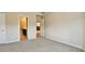 Spacious bedroom with neutral walls and carpet; offering lots of design versatility at 5381 Front Runner Ct, Sugar Hill, GA 30518