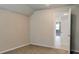 Unfurnished bedroom featuring neutral carpeting and an open door to another room at 5381 Front Runner Ct, Sugar Hill, GA 30518