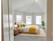 Bedroom with neutral carpeting and bright natural light from several windows at 5381 Front Runner Ct, Sugar Hill, GA 30518