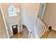 Elegant foyer with a hardwood floor, chandelier, and arched window above the front door at 5381 Front Runner Ct, Sugar Hill, GA 30518