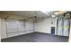Spacious garage featuring dual water heaters and an automatic door at 5381 Front Runner Ct, Sugar Hill, GA 30518