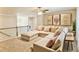 Inviting loft area with a comfortable sectional sofa, decorative pillows, and wall art at 5381 Front Runner Ct, Sugar Hill, GA 30518