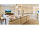 Upstairs loft featuring a cozy sectional sofa with colorful decor and mounted TV screen at 5381 Front Runner Ct, Sugar Hill, GA 30518