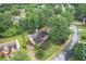 Beautiful aerial view of a home with a well-manicured lawn, mature trees, and a private backyard at 10865 Glenhurst Pass, Duluth, GA 30097
