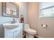 Cozy bathroom with a modern sink, stylish mirror, and fixtures at 10865 Glenhurst Pass, Duluth, GA 30097