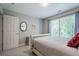 Comfortable bedroom with a large window and neutral decor at 10865 Glenhurst Pass, Duluth, GA 30097