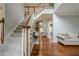 The home features an inviting foyer with hardwood floors and an elegant staircase at 10865 Glenhurst Pass, Duluth, GA 30097