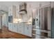 Beautiful kitchen featuring stainless steel appliances, hardwood floors, and stone countertops at 10865 Glenhurst Pass, Duluth, GA 30097
